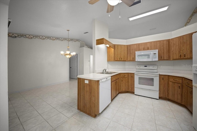 4992 NW 31st St, Ocala, FL 34482 - kitchen with white appliances, a sink, a chandelier, brown cabinets, and lofted ceiling