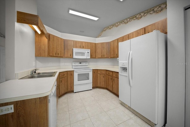 4992 NW 31st St, Ocala, FL 34482 - kitchen with white appliances, brown cabinets, light countertops, light tile patterned floors, and a sink