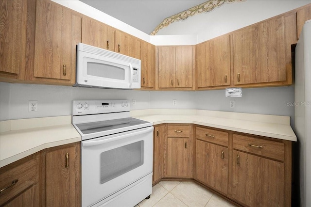 4992 NW 31st St, Ocala, FL 34482 - kitchen featuring white appliances, light countertops, and brown cabinets