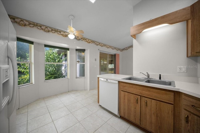4992 NW 31st St, Ocala, FL 34482 - kitchen featuring white dishwasher, a sink, ceiling fan, light countertops, and light tile patterned floors