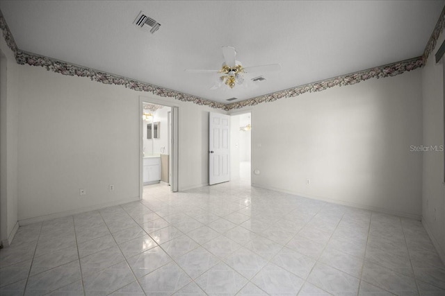 4992 NW 31st St, Ocala, FL 34482 - empty room with ceiling fan, light tile patterned floors, and baseboards