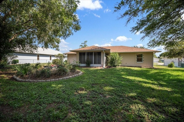 4992 NW 31st St, Ocala, FL 34482 - rear view of house with stucco siding and a sunroom