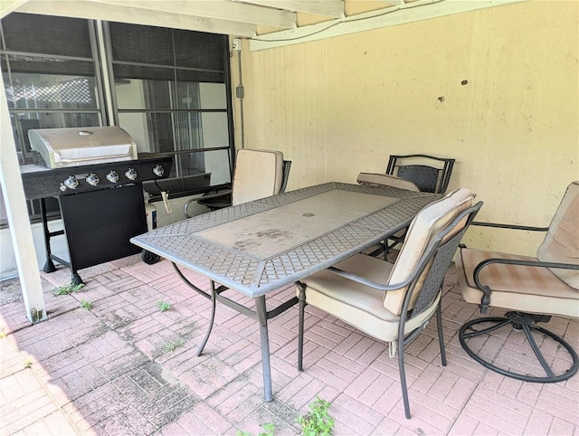 21298 SW Peach Blossom St, Dunnellon, FL 34431 - view of patio featuring outdoor dining area and grilling area