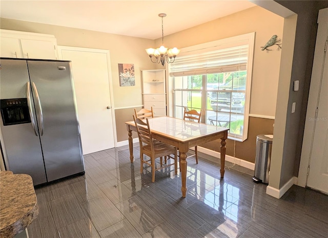 21298 SW Peach Blossom St, Dunnellon, FL 34431 - dining area with baseboards and a chandelier