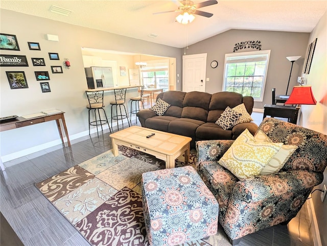 21298 SW Peach Blossom St, Dunnellon, FL 34431 - living room featuring a ceiling fan, healthy amount of natural light, lofted ceiling, baseboards, and wood finished floors