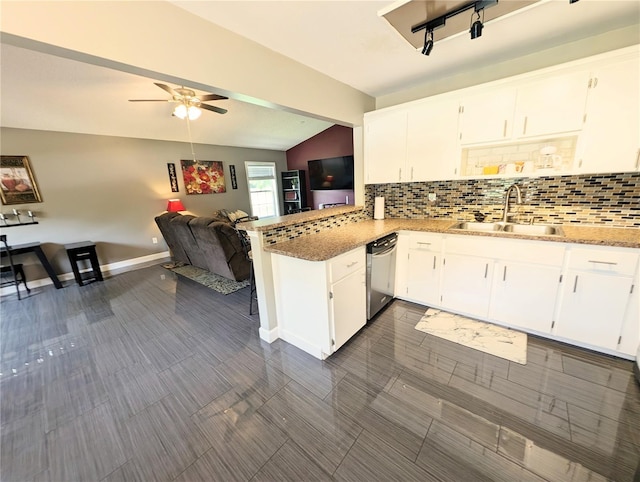 21298 SW Peach Blossom St, Dunnellon, FL 34431 - kitchen with a sink, stainless steel dishwasher, tasteful backsplash, open floor plan, and vaulted ceiling