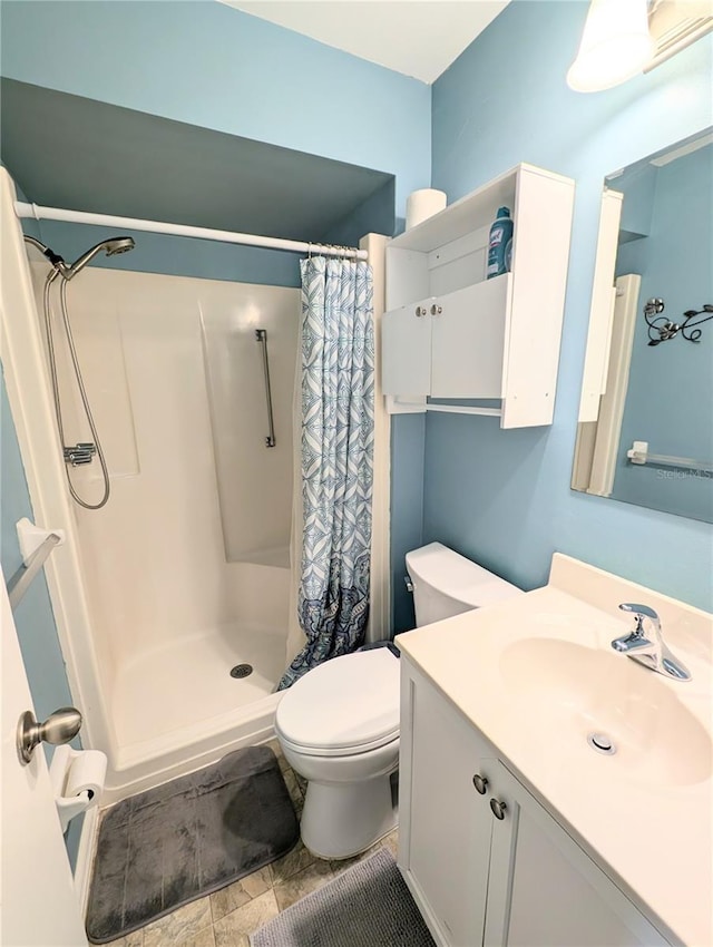 21298 SW Peach Blossom St, Dunnellon, FL 34431 - bathroom featuring a shower stall, toilet, and vanity