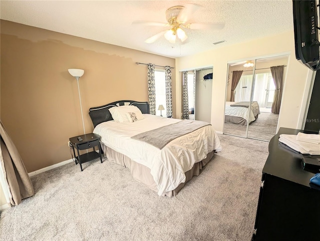 21298 SW Peach Blossom St, Dunnellon, FL 34431 - bedroom with carpet flooring, ceiling fan, a textured ceiling, and baseboards