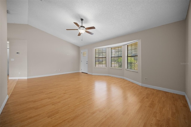 23 Larch Crse, Ocala, FL 34480 - spare room with ceiling fan, light wood-type flooring, a textured ceiling, lofted ceiling, and baseboards