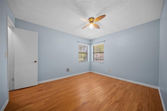 23 Larch Crse, Ocala, FL 34480 - spare room with ceiling fan, a textured ceiling, wood finished floors, and baseboards