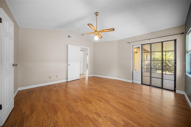 23 Larch Crse, Ocala, FL 34480 - spare room featuring a ceiling fan, wood finished floors, vaulted ceiling, and baseboards