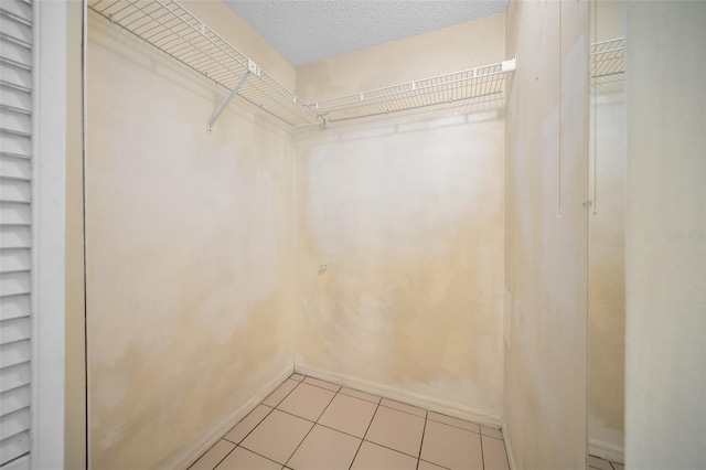 23 Larch Crse, Ocala, FL 34480 - walk in closet featuring light tile patterned flooring