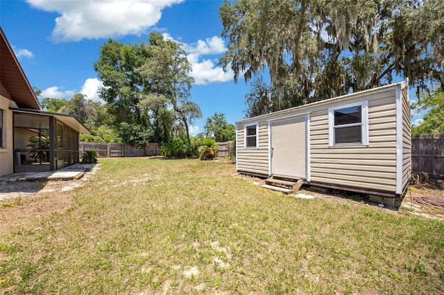 23 Larch Crse, Ocala, FL 34480 - view of yard featuring an outdoor structure and a sunroom