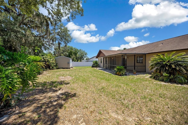 23 Larch Crse, Ocala, FL 34480 - view of yard featuring a storage shed, a sunroom, and an outdoor structure
