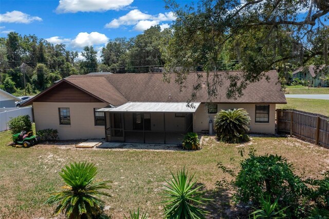 23 Larch Crse, Ocala, FL 34480 - back of property with a sunroom