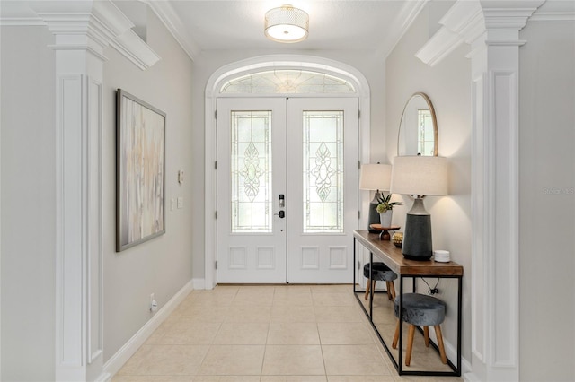 entryway featuring ornate columns, plenty of natural light, and french doors
