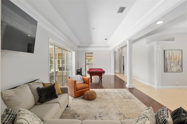 living room with ornate columns, billiards table, recessed lighting, baseboards, and crown molding