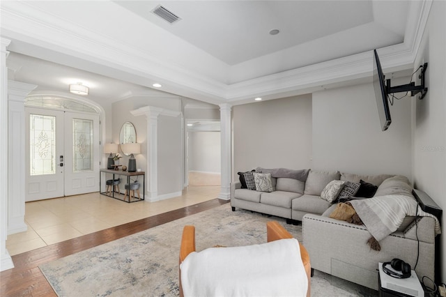 living room with decorative columns, french doors, wood finished floors, and recessed lighting