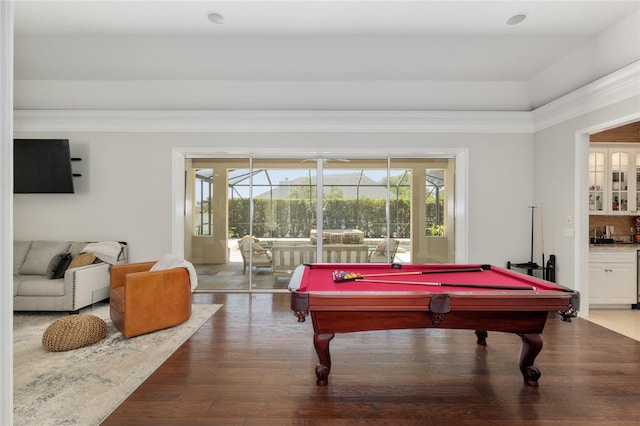 game room with pool table, wood finished floors, and crown molding