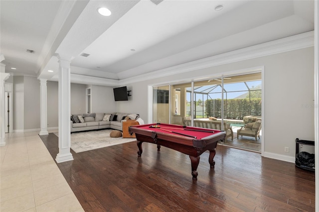 recreation room with crown molding, ornate columns, a tray ceiling, billiards table, and baseboards