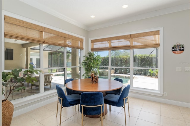 dining area with crown molding, light tile patterned floors, baseboards, and recessed lighting