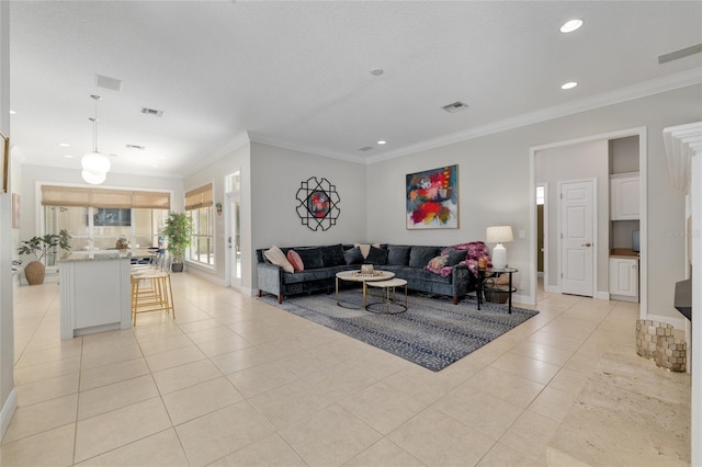 living room with light tile patterned floors, crown molding, recessed lighting, and baseboards