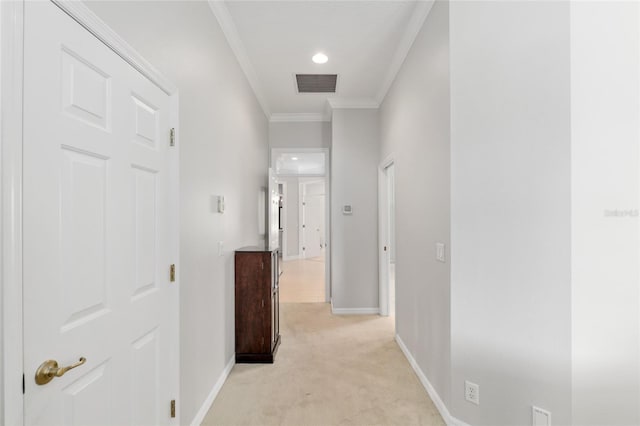 hall featuring light carpet, crown molding, baseboards, and recessed lighting
