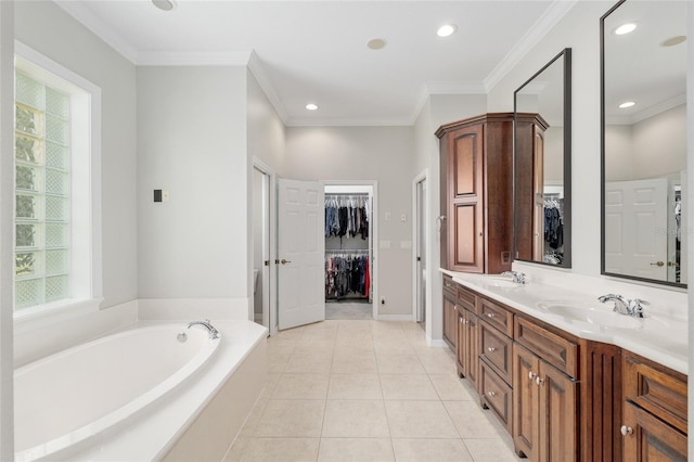 full bathroom with a spacious closet, a bath, double vanity, crown molding, and tile patterned flooring
