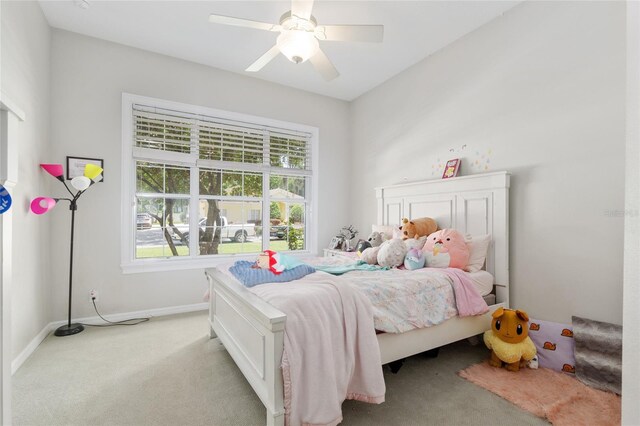 bedroom featuring carpet, baseboards, and a ceiling fan