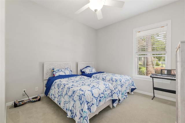 bedroom featuring carpet flooring, baseboards, and a ceiling fan