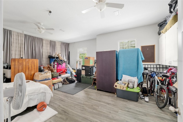 bedroom featuring wood finished floors and ceiling fan