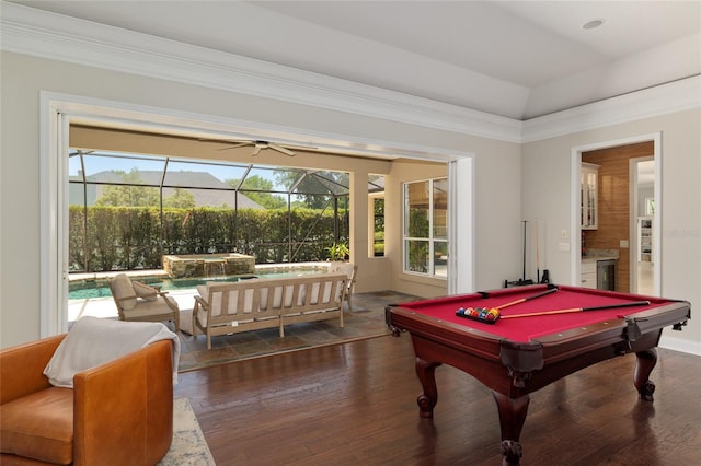 recreation room with dark wood finished floors, billiards, ceiling fan, and ornamental molding