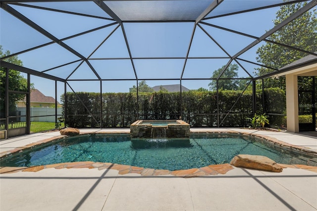 view of pool with a patio, a lanai, and a pool with connected hot tub