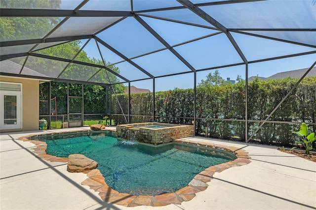 view of swimming pool with a patio, a lanai, and a pool with connected hot tub