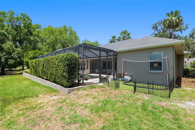 back of property featuring stucco siding, a lanai, a patio, and roof with shingles