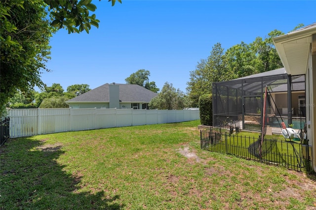 view of yard featuring a lanai