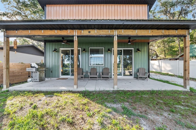 754 SE 167th Court Rd, Silver Springs, FL 34488 - back of property featuring a ceiling fan, a patio, and fence