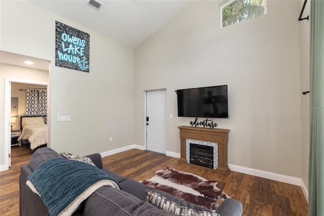 754 SE 167th Court Rd, Silver Springs, FL 34488 - living room featuring high vaulted ceiling, baseboards, wood finished floors, and a fireplace