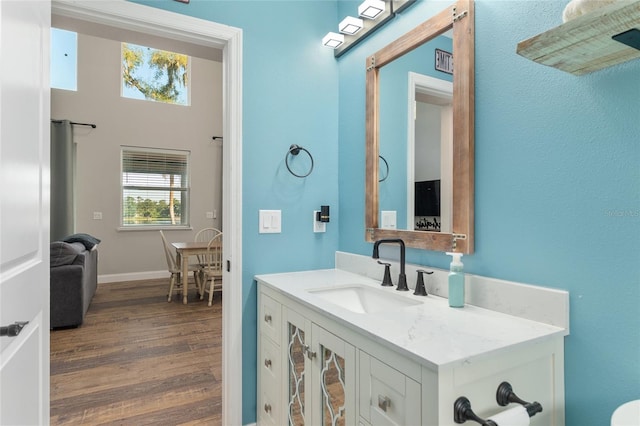 754 SE 167th Court Rd, Silver Springs, FL 34488 - bathroom with wood finished floors, vanity, and baseboards