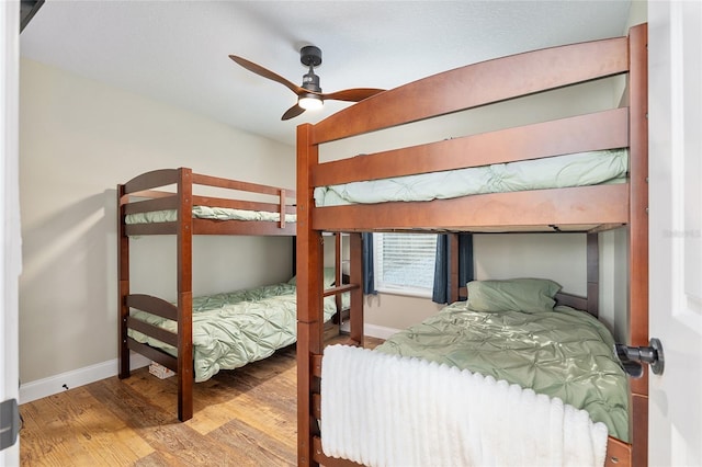 754 SE 167th Court Rd, Silver Springs, FL 34488 - bedroom with wood finished floors, baseboards, and a ceiling fan