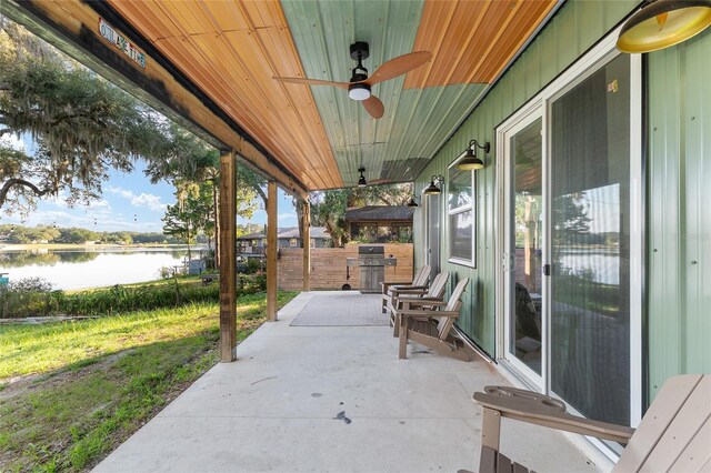 754 SE 167th Court Rd, Silver Springs, FL 34488 - view of patio with a water view, ceiling fan, and area for grilling