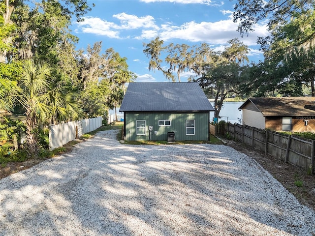 754 SE 167th Court Rd, Silver Springs, FL 34488 - back of property with fence and gravel driveway