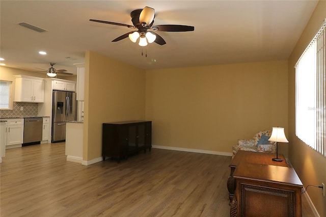 6472 SW 106th Pl, Ocala, FL 34476 - living area with a ceiling fan, wood finished floors, recessed lighting, and baseboards