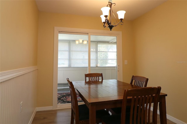 6472 SW 106th Pl, Ocala, FL 34476 - dining area featuring a chandelier and wood finished floors