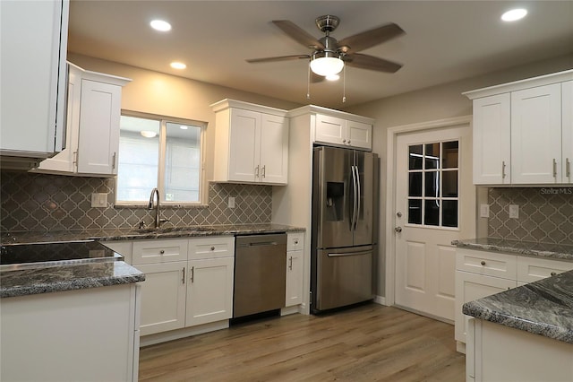 6472 SW 106th Pl, Ocala, FL 34476 - kitchen with appliances with stainless steel finishes, a sink, tasteful backsplash, recessed lighting, and white cabinets