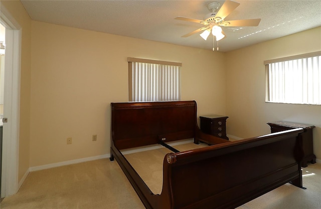 6472 SW 106th Pl, Ocala, FL 34476 - bedroom with light carpet, baseboards, and ceiling fan