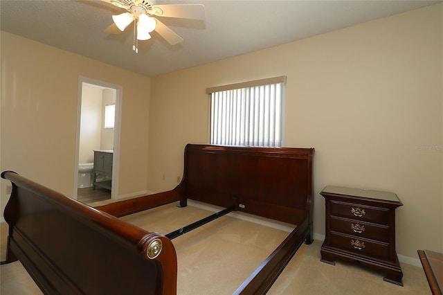 6472 SW 106th Pl, Ocala, FL 34476 - bedroom with carpet, ensuite bathroom, multiple windows, and baseboards