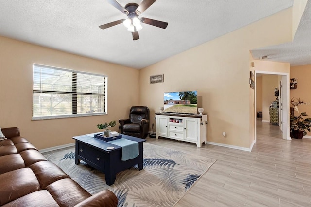 729 Sinclair Ter, Inverness, FL 34450 - living room featuring a ceiling fan, baseboards, a textured ceiling, and light wood-style floors