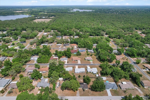 729 Sinclair Ter, Inverness, FL 34450 - view of property location featuring a heavily wooded area, a large body of water, and nearby suburban area