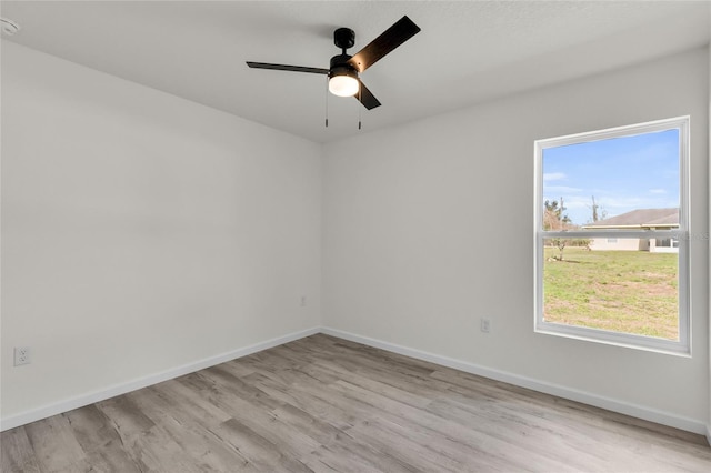 5353 NW 4th St, Ocala, FL 34482 - empty room with light wood-style flooring, baseboards, and ceiling fan